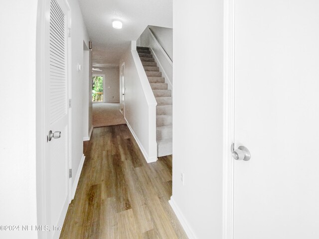 hallway with light hardwood / wood-style flooring