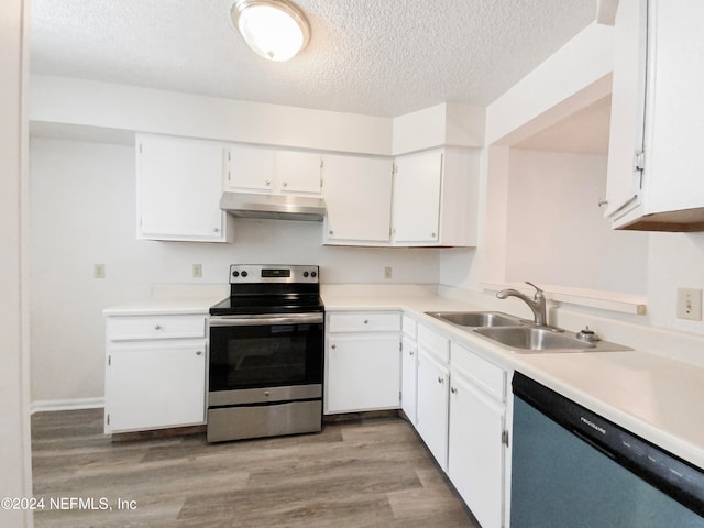 kitchen featuring stainless steel appliances, a textured ceiling, light hardwood / wood-style flooring, white cabinetry, and sink