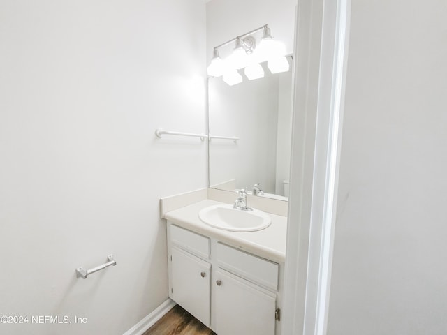 bathroom featuring hardwood / wood-style floors and vanity