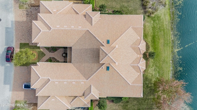 birds eye view of property featuring a water view