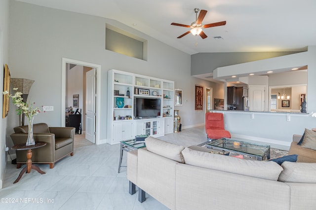 living room with ceiling fan and high vaulted ceiling