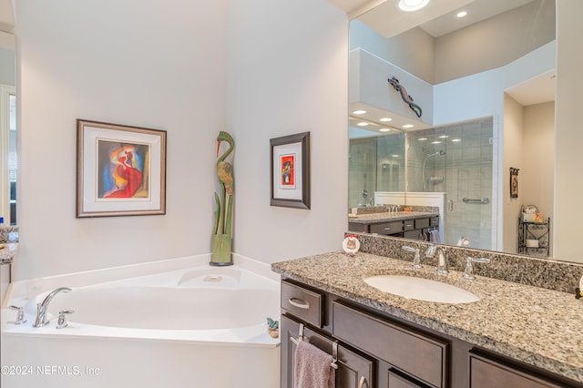 bathroom featuring vanity and separate shower and tub