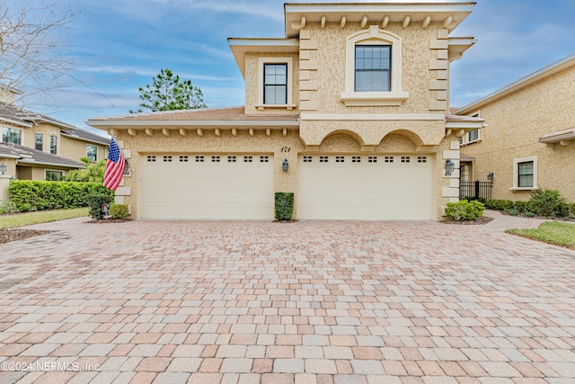 view of front of home with a garage