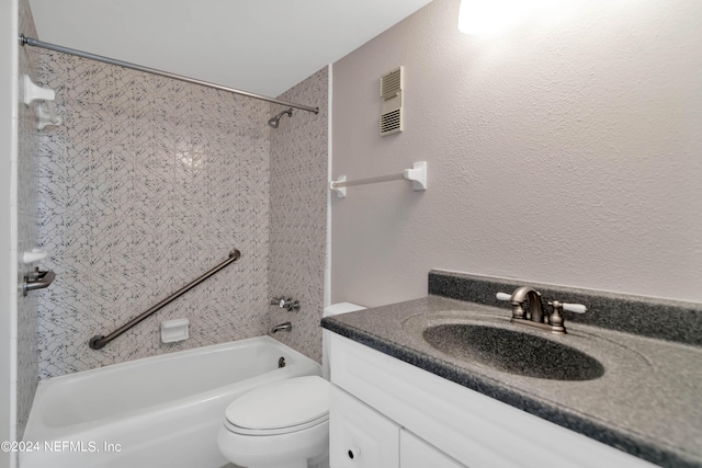 full bathroom featuring vanity, toilet, and tiled shower / bath