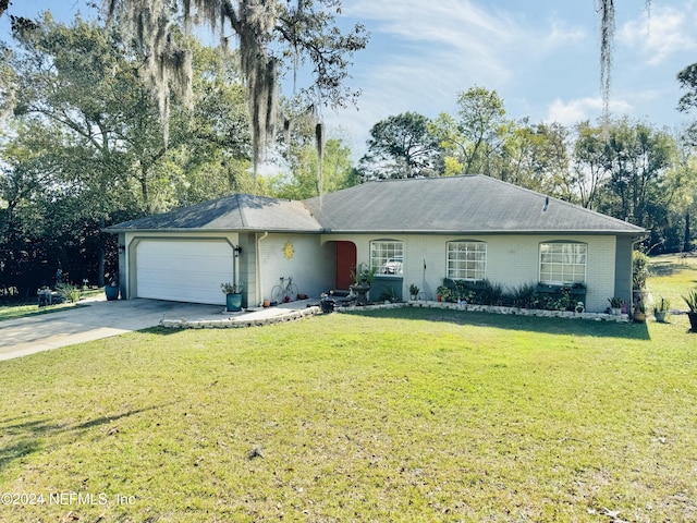 single story home featuring a garage and a front yard