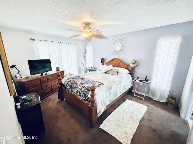 carpeted bedroom with ceiling fan and a textured ceiling