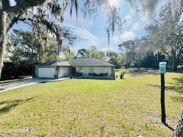 ranch-style house with a garage and a front yard