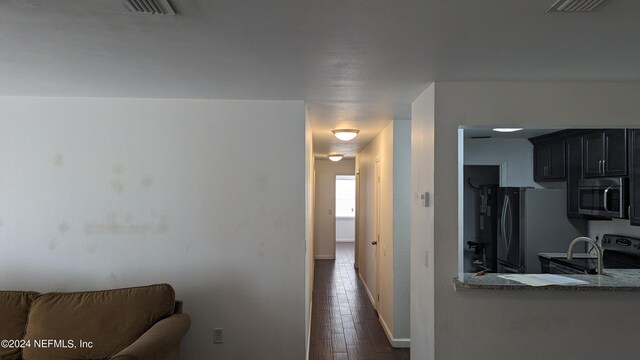 hall with dark hardwood / wood-style floors