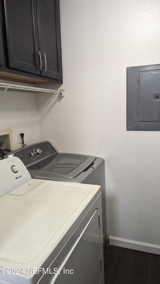 washroom with cabinets and washer and clothes dryer