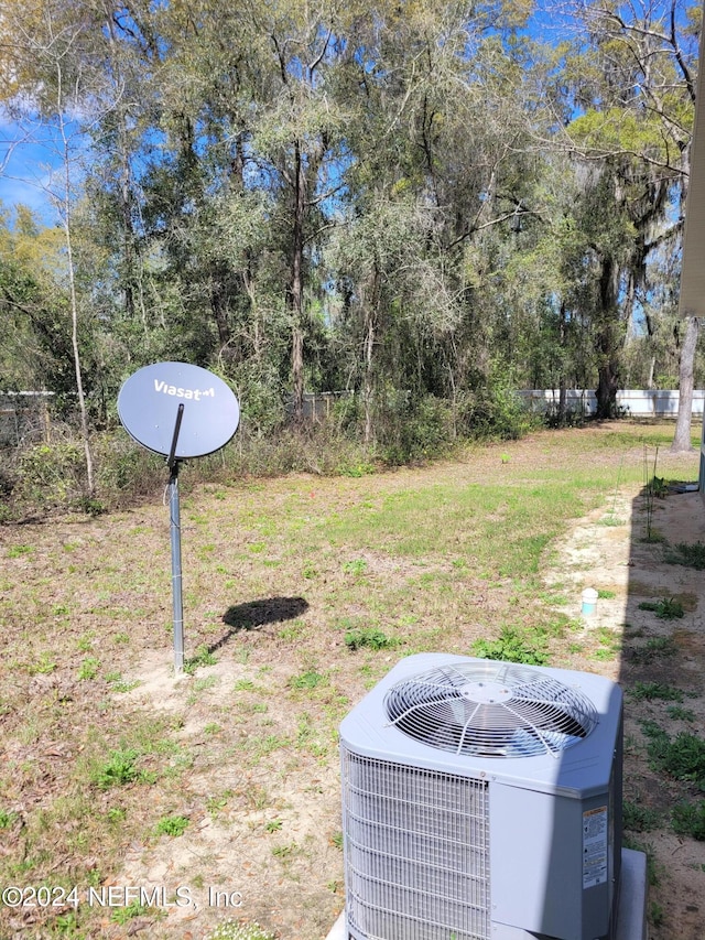 view of yard with central air condition unit