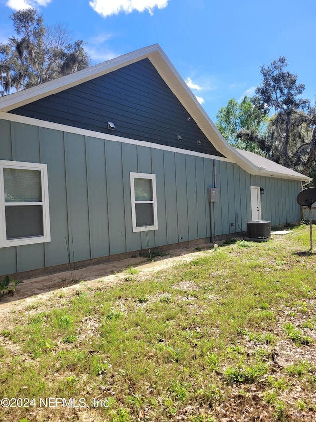 view of home's exterior with a yard