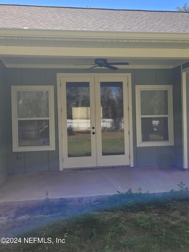 entrance to property featuring french doors and ceiling fan