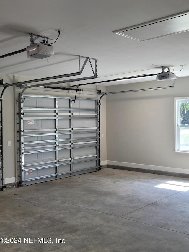 garage featuring a garage door opener