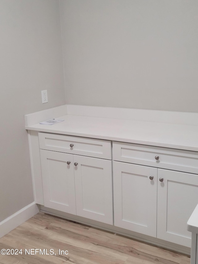 bathroom featuring vanity and hardwood / wood-style flooring