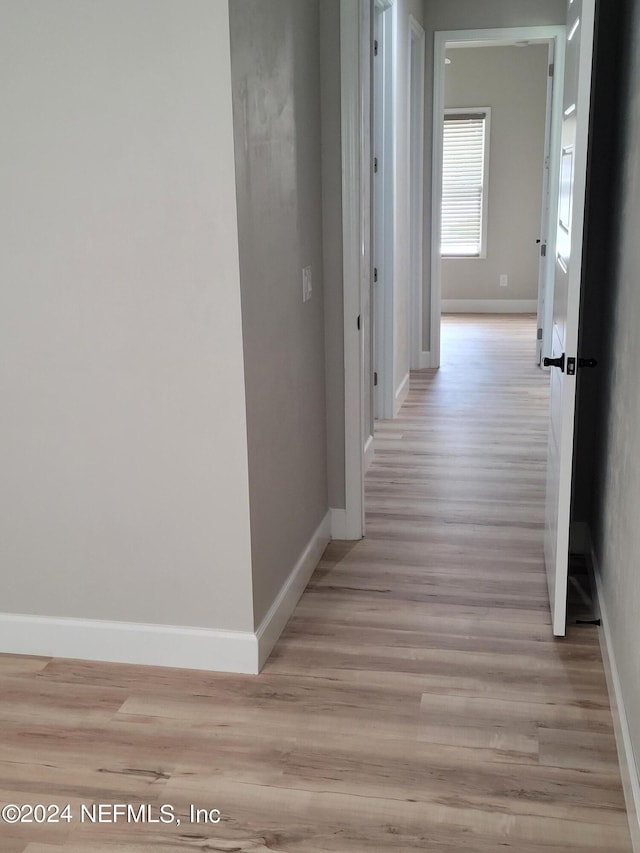 hall featuring light wood-type flooring