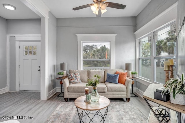 interior space featuring light hardwood / wood-style floors and ceiling fan