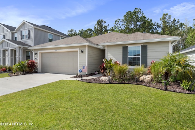 view of front facade with a garage and a front yard