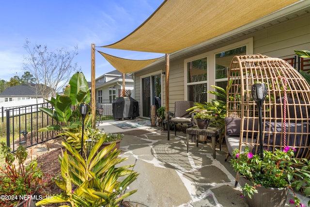 view of patio / terrace featuring area for grilling and fence