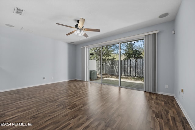 spare room featuring ceiling fan and dark hardwood / wood-style flooring