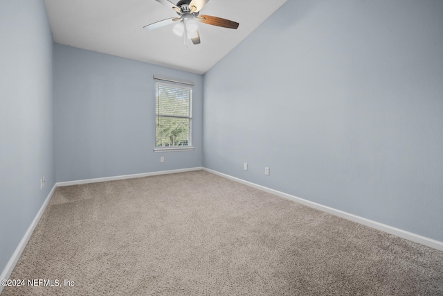 empty room featuring carpet flooring, ceiling fan, and lofted ceiling