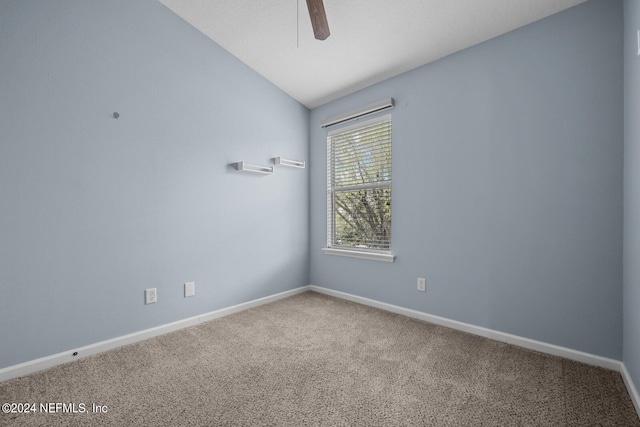 unfurnished room with ceiling fan, carpet, and lofted ceiling