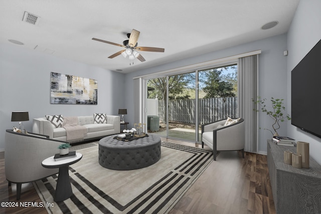 living room with hardwood / wood-style floors and ceiling fan