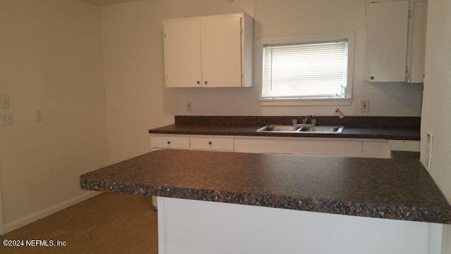 kitchen with white cabinets and sink