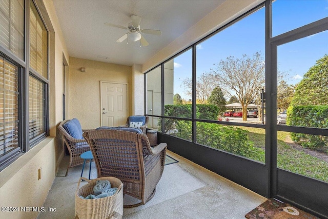 sunroom / solarium with ceiling fan