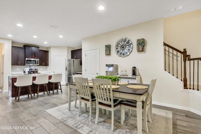 dining area with light hardwood / wood-style flooring