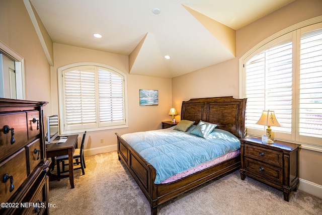 carpeted bedroom featuring multiple windows