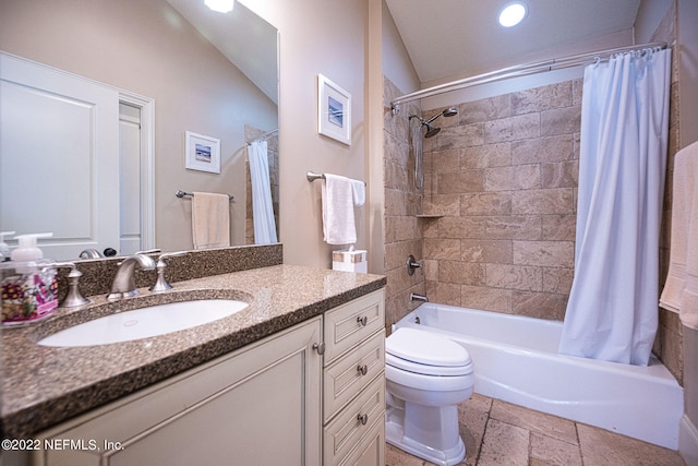 full bathroom featuring lofted ceiling, vanity, toilet, and shower / bathtub combination with curtain