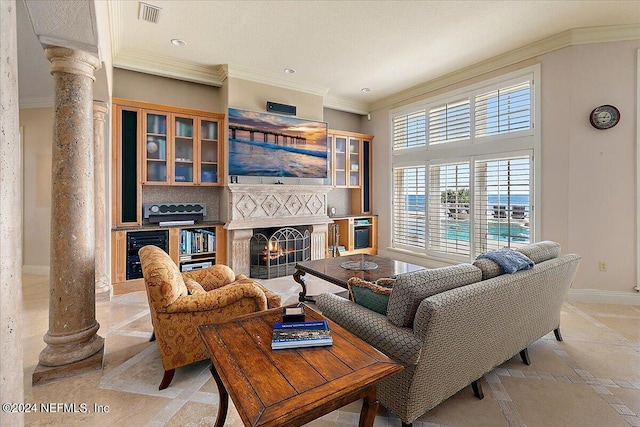 1201 Ponte Vedra Blvd, Ponte Vedra Beach, FL 32082 - living area featuring crown molding, wine cooler, ornate columns, visible vents, and stone tile flooring