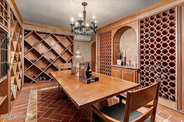 1201 Ponte Vedra Blvd, Ponte Vedra Beach, FL 32082 - wine area featuring crown molding, a textured ceiling, an inviting chandelier, and a sink