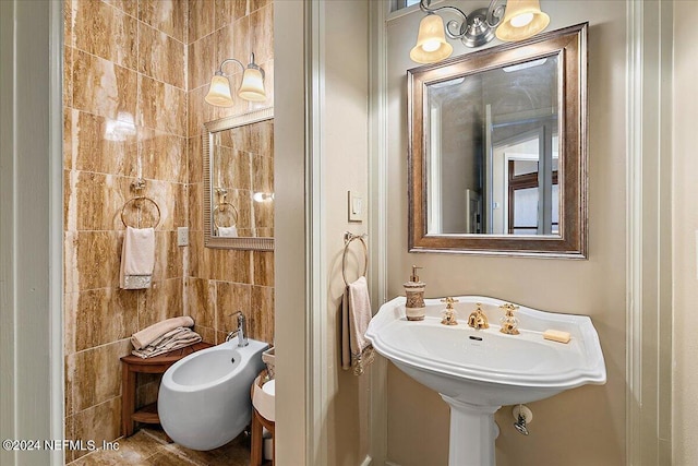 bathroom featuring tile walls and a bidet