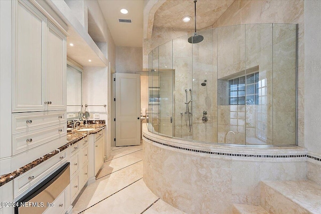 bathroom with tile walls, vanity, tile patterned floors, and an enclosed shower