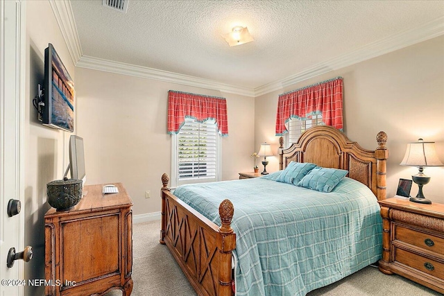 bedroom with ornamental molding, a textured ceiling, and light colored carpet