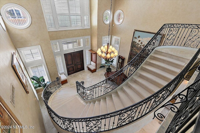 1201 Ponte Vedra Blvd, Ponte Vedra Beach, FL 32082 - foyer entrance featuring plenty of natural light, a high ceiling, a chandelier, and stairway