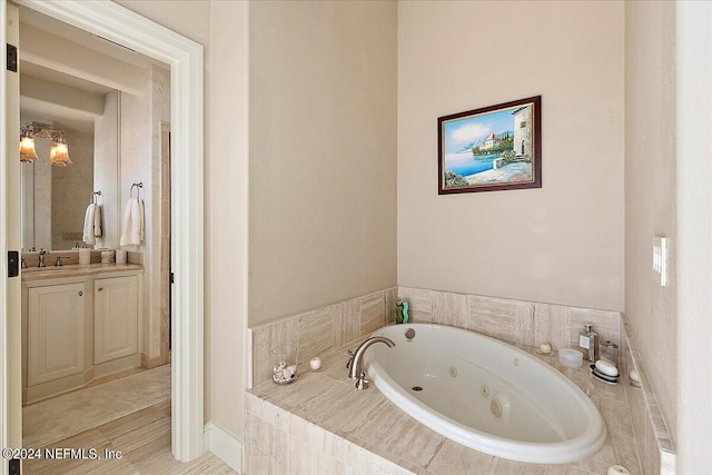 1201 Ponte Vedra Blvd, Ponte Vedra Beach, FL 32082 - bathroom featuring vanity, wood finished floors, and a jetted tub