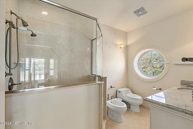 bathroom with vanity, a bidet, tile patterned floors, walk in shower, and toilet