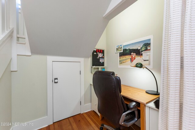 office space featuring light hardwood / wood-style floors and lofted ceiling