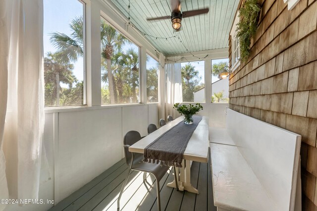 sunroom / solarium with ceiling fan