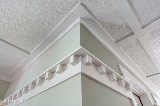 staircase with a textured ceiling