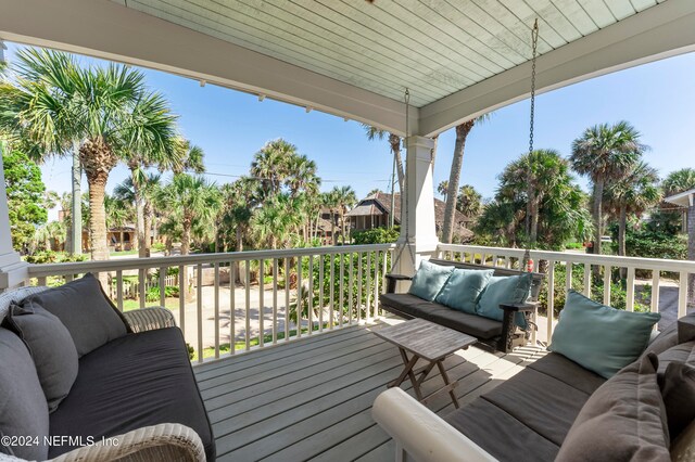 wooden deck with an outdoor hangout area