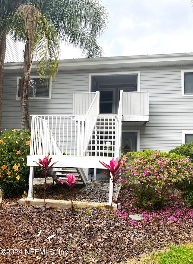 back of house with a balcony