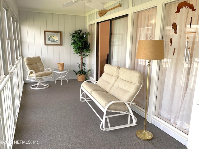 sunroom featuring ceiling fan