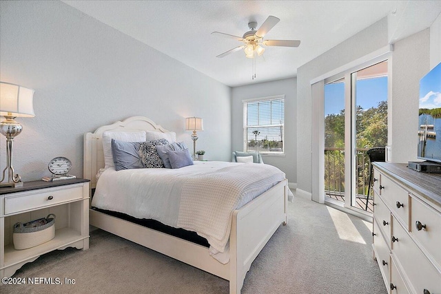 bedroom with light carpet, access to outside, baseboards, and a ceiling fan