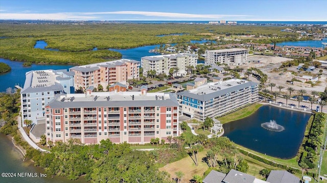 drone / aerial view featuring a water view and a city view