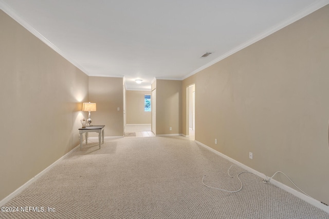 unfurnished room featuring light carpet and ornamental molding