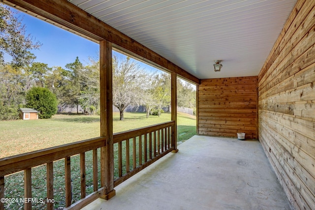 view of terrace featuring a storage shed