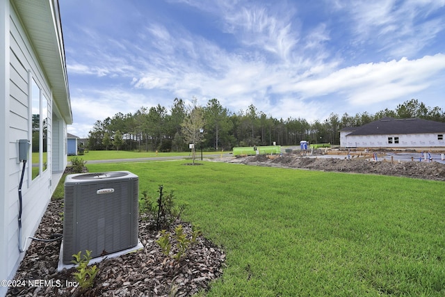 view of yard with central AC